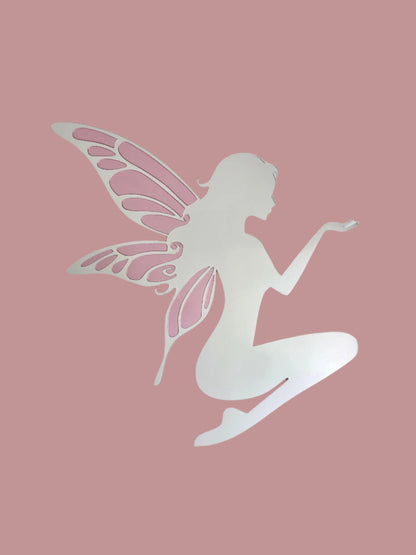 Silhouette of a fairy with pink wings on a light pink background